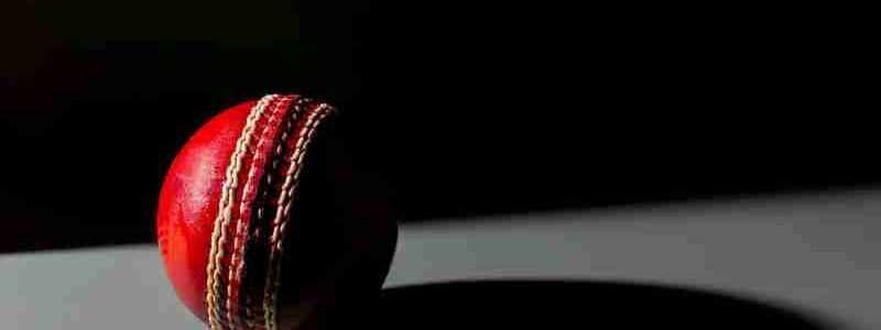 Dramatic image of a red cricket ball casting a shadow, highlighting texture and detail., tags: englands der - pexel